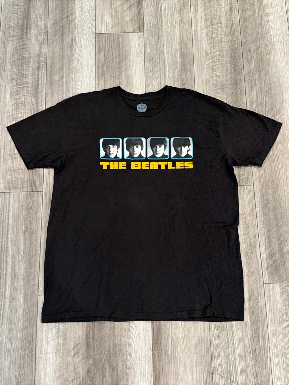 The Beatles Official Merch Black Short Sleeve Tee with Yellow Logo